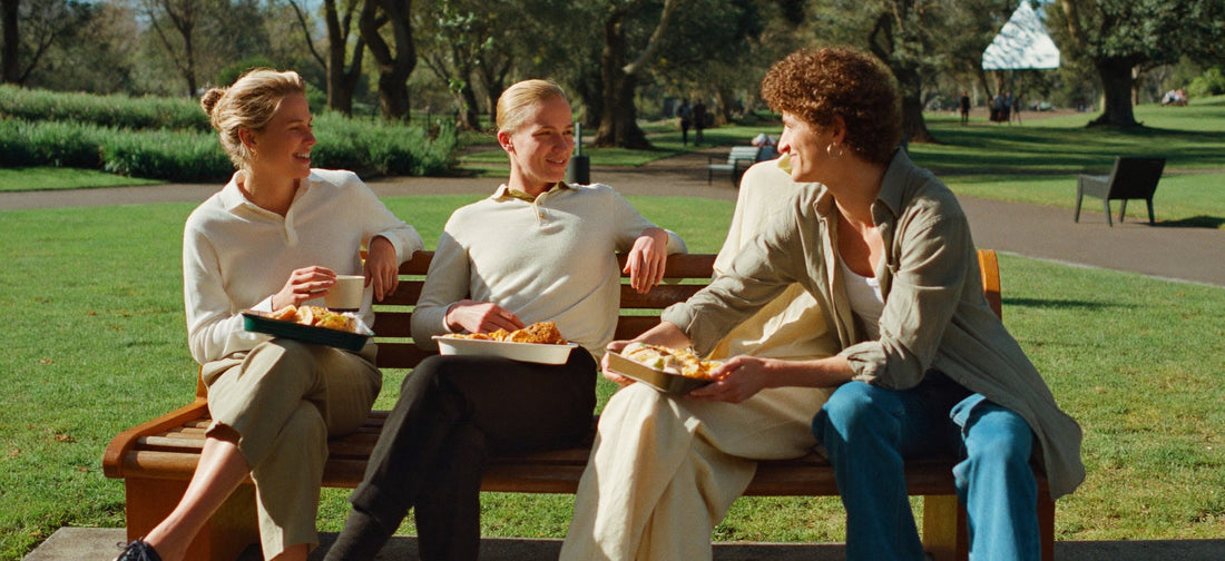 Young adults chatting during an outdoor lunch break in a South African park