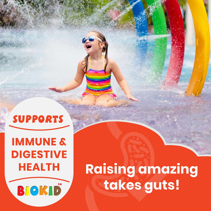 Child playing happily in water park, promoting BioKid™ Probiotics Chewables for immune and digestive health.