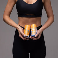 person holding 21-Day GUTSLIM GLP-1 Booster and Fat Burner supplements for fat loss and metabolism boost