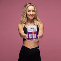 Woman holding Femina COMBO Care package for feminine intimate health and wellness with probiotics and cranberry extract