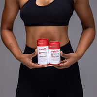 Velo16 Probiotic Capsules for digestive health and immunity boost held by person in black sportswear